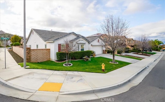 single story home featuring a garage, stucco siding, a front yard, and fence