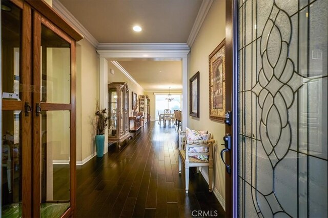 30459 Cowboy Ln, Menifee, CA 92584 - corridor featuring baseboards, a chandelier, dark wood finished floors, and crown molding