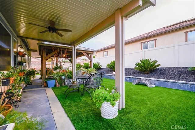 30459 Cowboy Ln, Menifee, CA 92584 - view of yard featuring ceiling fan and a patio area