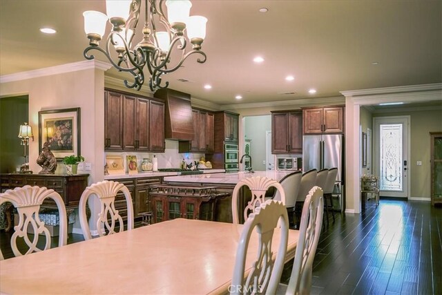 30459 Cowboy Ln, Menifee, CA 92584 - dining room featuring a chandelier, recessed lighting, crown molding, baseboards, and dark wood finished floors