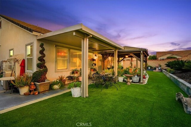30459 Cowboy Ln, Menifee, CA 92584 - rear view of property with ceiling fan, a patio area, and stucco siding