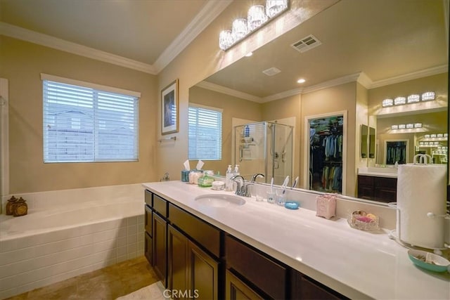 full bathroom featuring a garden tub, visible vents, a stall shower, vanity, and a spacious closet