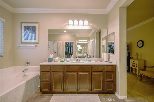 bathroom with crown molding, vanity, a bath, a stall shower, and a wealth of natural light