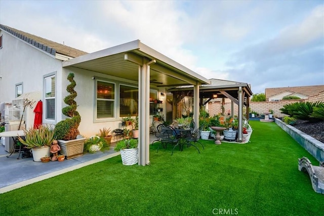 30459 Cowboy Ln, Menifee, CA 92584 - rear view of property with stucco siding, ceiling fan, and a patio