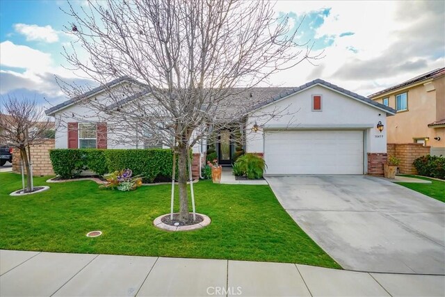 30459 Cowboy Ln, Menifee, CA 92584 - ranch-style house with an attached garage, a front lawn, driveway, and stucco siding