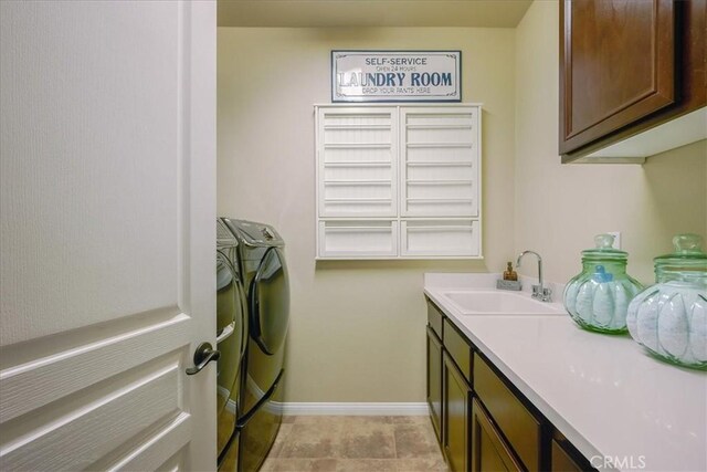 30459 Cowboy Ln, Menifee, CA 92584 - laundry room with washing machine and clothes dryer, cabinet space, and baseboards