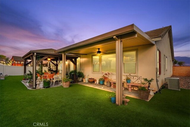 30459 Cowboy Ln, Menifee, CA 92584 - back of house with central AC, a gazebo, a patio, ceiling fan, and stucco siding