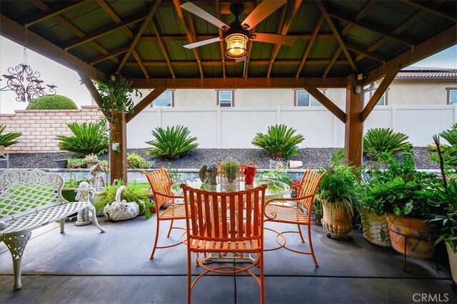 30459 Cowboy Ln, Menifee, CA 92584 - fenced backyard featuring a gazebo, outdoor dining area, and a patio area