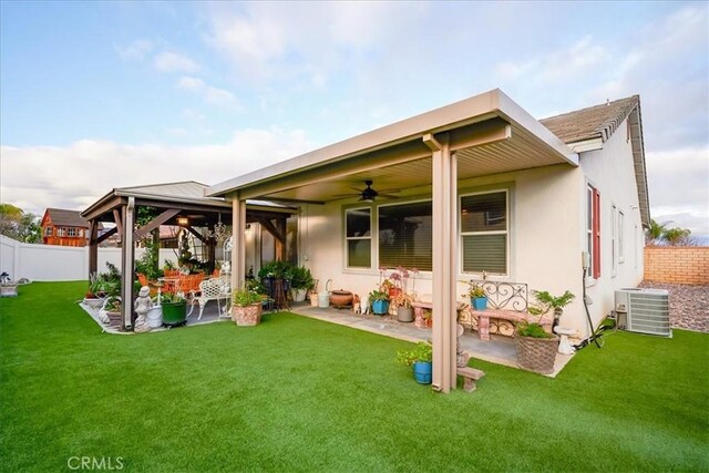 30459 Cowboy Ln, Menifee, CA 92584 - back of house featuring a gazebo, central air condition unit, a patio, ceiling fan, and stucco siding
