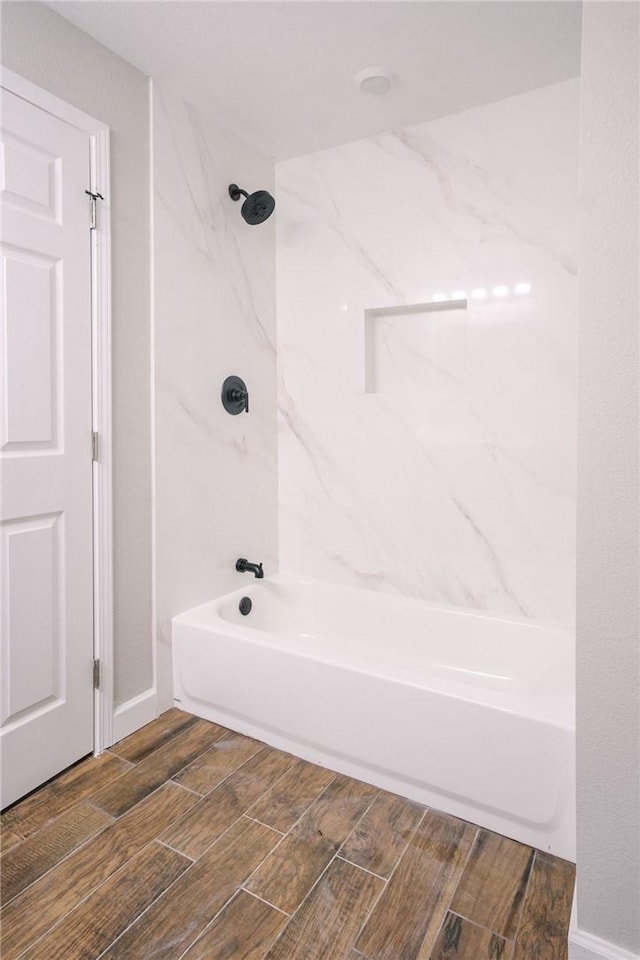 full bathroom featuring shower / bathing tub combination and wood tiled floor