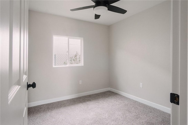 empty room featuring baseboards, ceiling fan, and carpet flooring