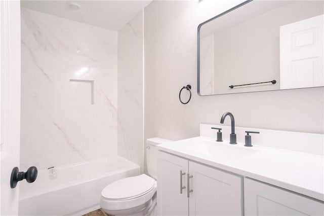 bathroom with toilet, vanity, and bathing tub / shower combination