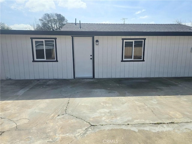 view of front of property featuring roof with shingles