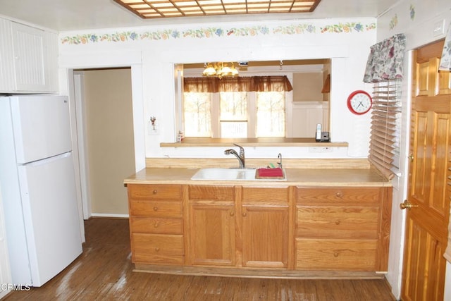 1173 Cliff Ave, Fillmore, CA 93015 - kitchen featuring freestanding refrigerator, a chandelier, a sink, dark wood-style floors, and light countertops