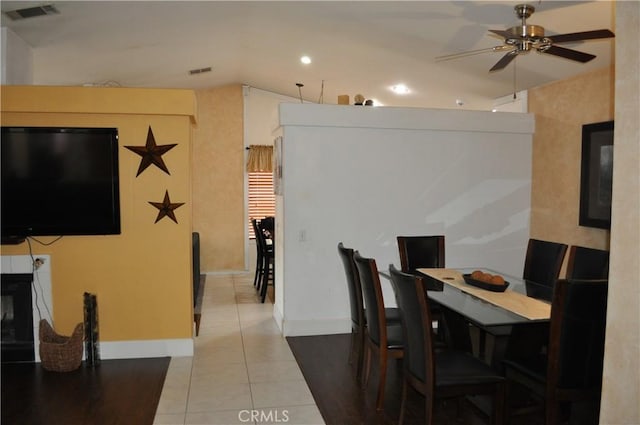 dining space featuring tile patterned flooring, baseboards, visible vents, and ceiling fan