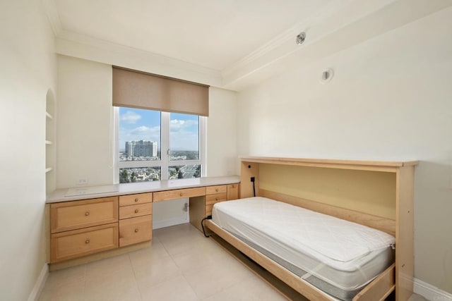 bedroom with a view of city, ornamental molding, built in desk, light tile patterned floors, and baseboards