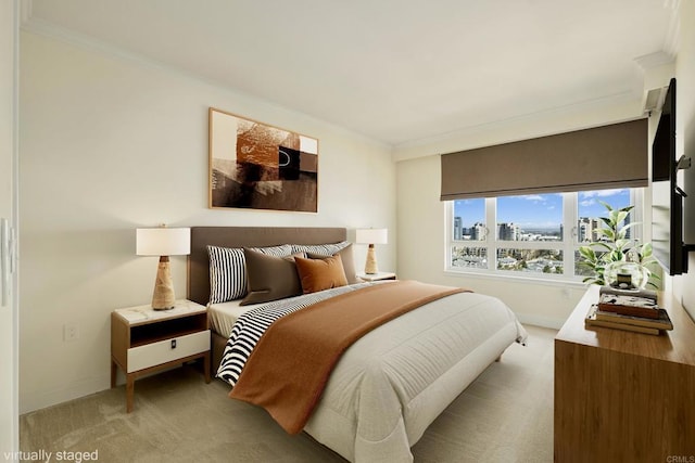 bedroom with a city view, crown molding, carpet, and baseboards