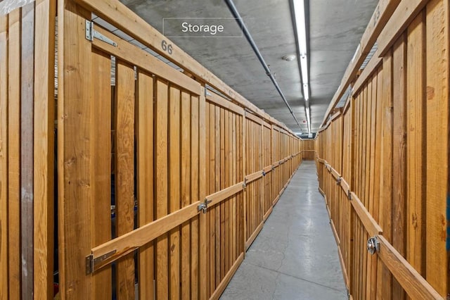 hallway with concrete floors