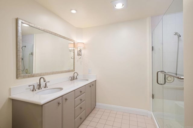 3890 Nobel Dr Unit 1307, San Diego, CA 92122 - full bathroom featuring an enclosed shower, double vanity, tile patterned floors, and baseboards