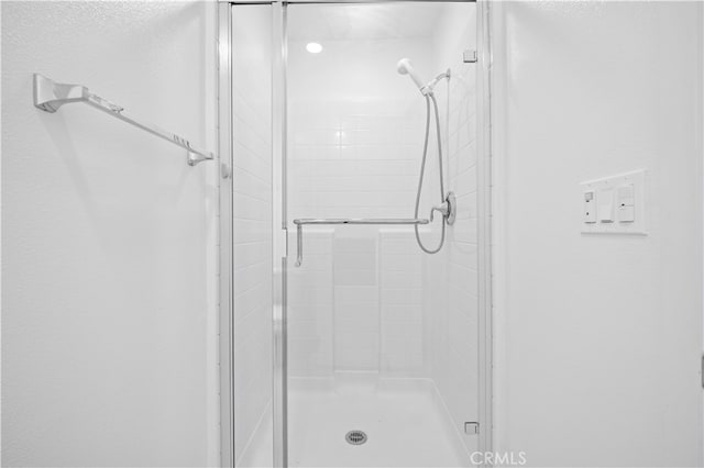 full bathroom with a shower stall
