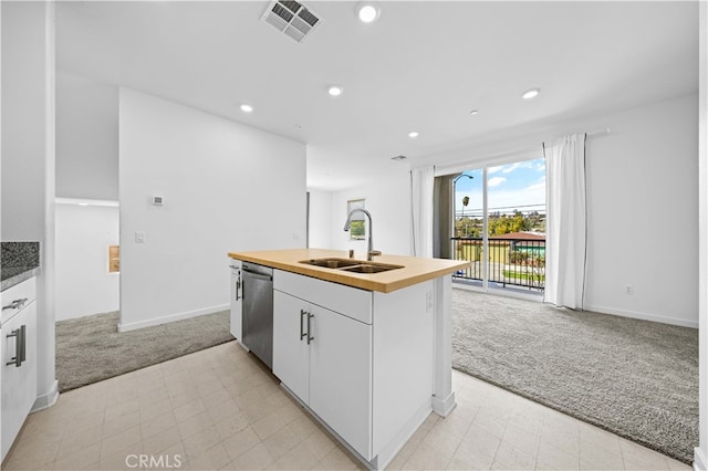 kitchen with light carpet, visible vents, dishwasher, and a sink