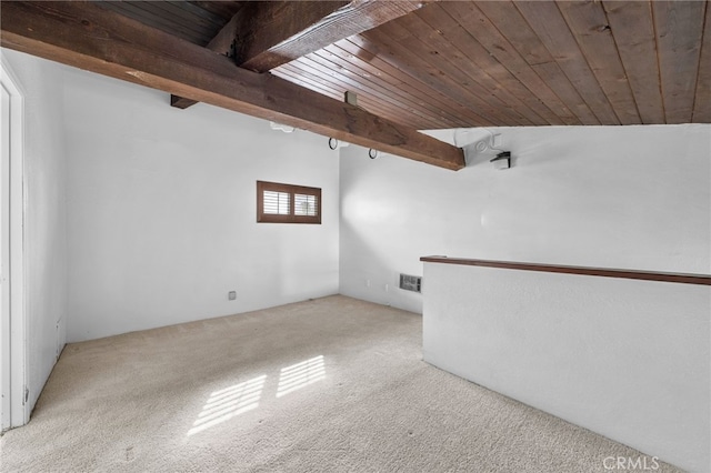 interior space with wood ceiling, carpet flooring, and visible vents