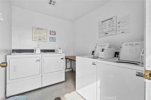 common laundry area with visible vents and washer and dryer