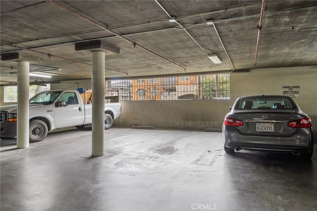 parking garage featuring concrete block wall