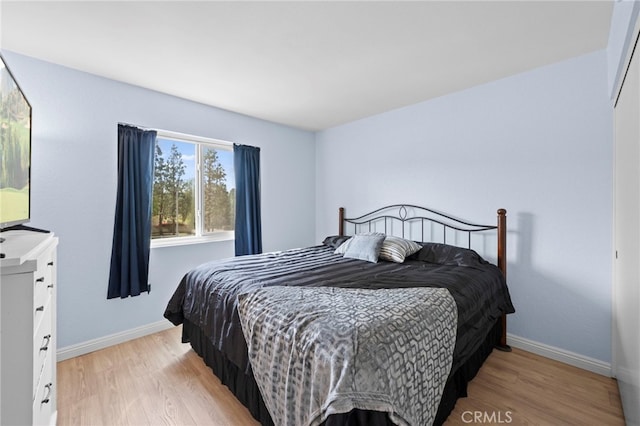 1330 Vista Grande Unit 27, Fullerton, CA 92835 - bedroom featuring light wood-type flooring and baseboards