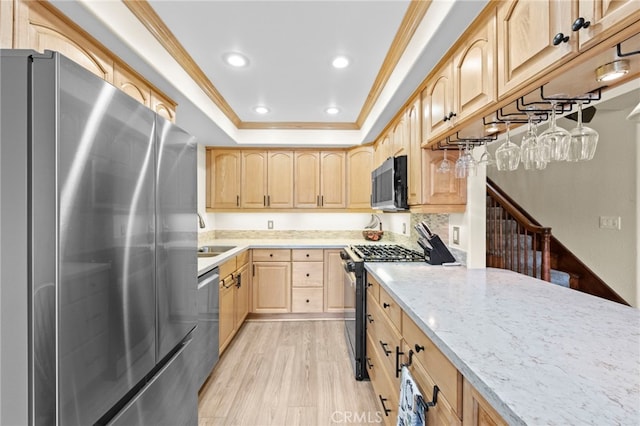 1330 Vista Grande Unit 27, Fullerton, CA 92835 - kitchen featuring stainless steel appliances, light brown cabinets, ornamental molding, a raised ceiling, and light wood-style floors