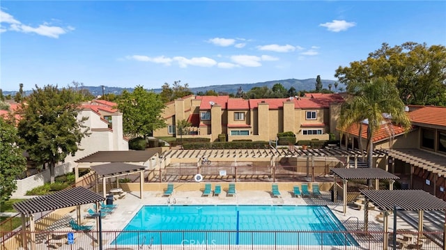 1330 Vista Grande Unit 27, Fullerton, CA 92835 - community pool with fence, a residential view, a mountain view, and a patio