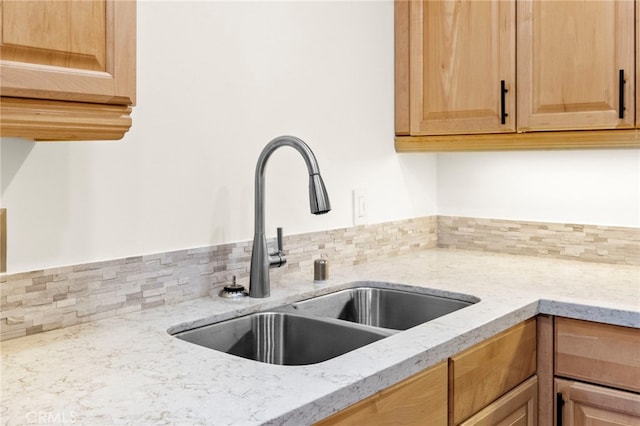 1330 Vista Grande Unit 27, Fullerton, CA 92835 - kitchen view of a sink, decorative backsplash, and light stone countertops