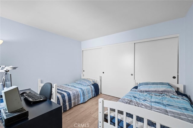 1330 Vista Grande Unit 27, Fullerton, CA 92835 - bedroom with light wood finished floors and a closet