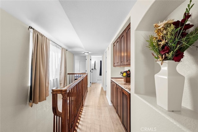 1330 Vista Grande Unit 27, Fullerton, CA 92835 - hall featuring light wood finished floors and an upstairs landing