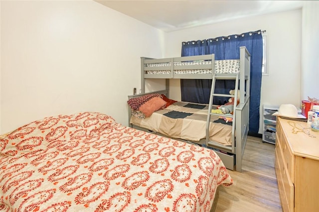 bedroom featuring wood finished floors