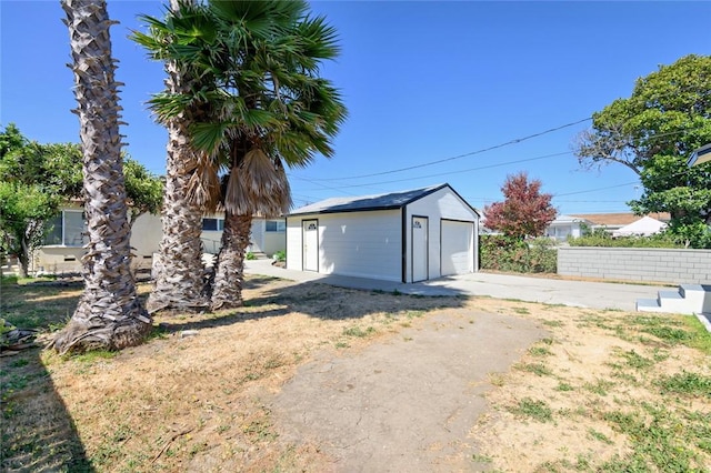 exterior space featuring concrete driveway