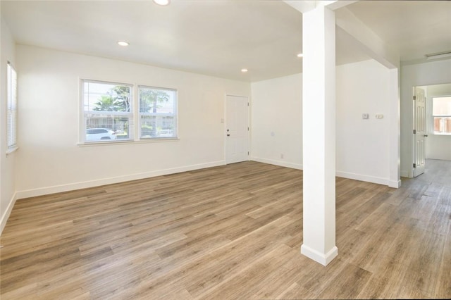 unfurnished room featuring light wood-style flooring, recessed lighting, and baseboards