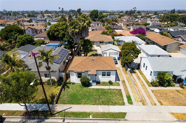 birds eye view of property with a residential view