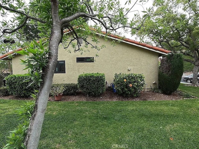 28132 Via Congora, Mission Viejo, CA 92692 - view of home's exterior featuring stucco siding and a yard
