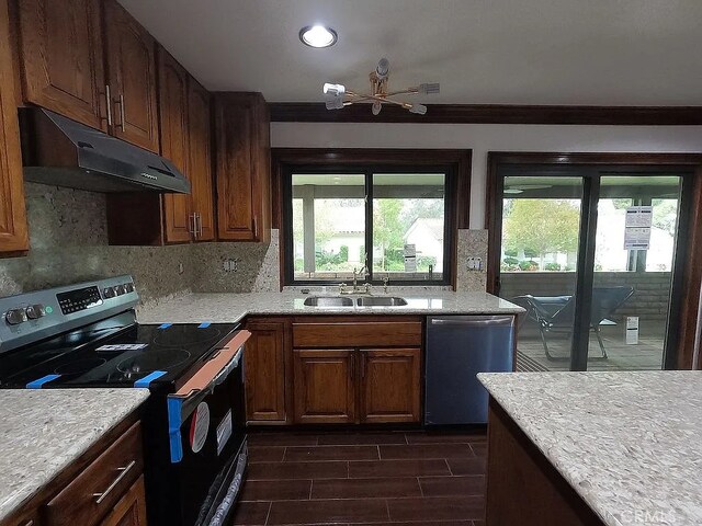28132 Via Congora, Mission Viejo, CA 92692 - kitchen with appliances with stainless steel finishes, tasteful backsplash, a sink, under cabinet range hood, and recessed lighting
