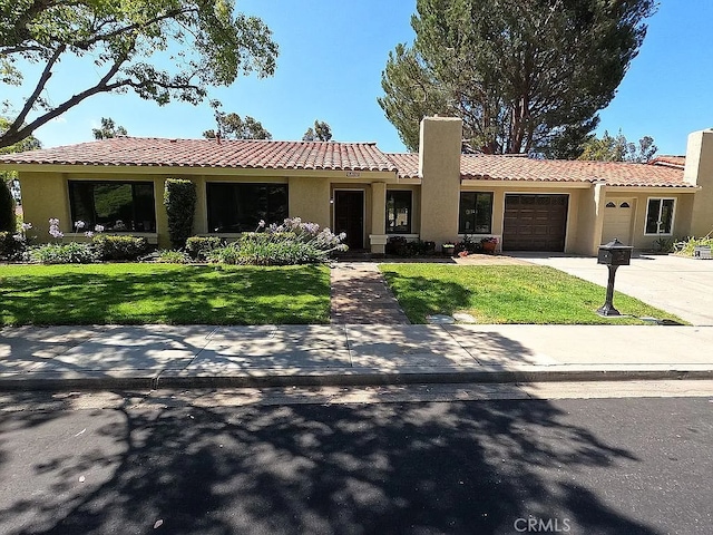 28132 Via Congora, Mission Viejo, CA 92692 - ranch-style home featuring stucco siding, a front lawn, a tile roof, and a garage