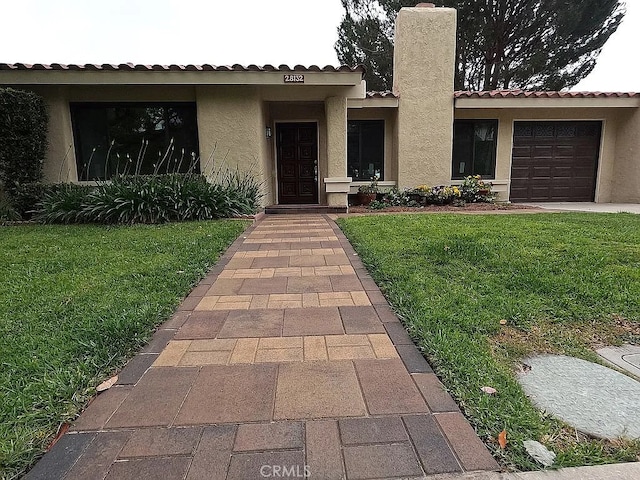 28132 Via Congora, Mission Viejo, CA 92692 - view of front of property with a chimney, stucco siding, a tile roof, and a front yard
