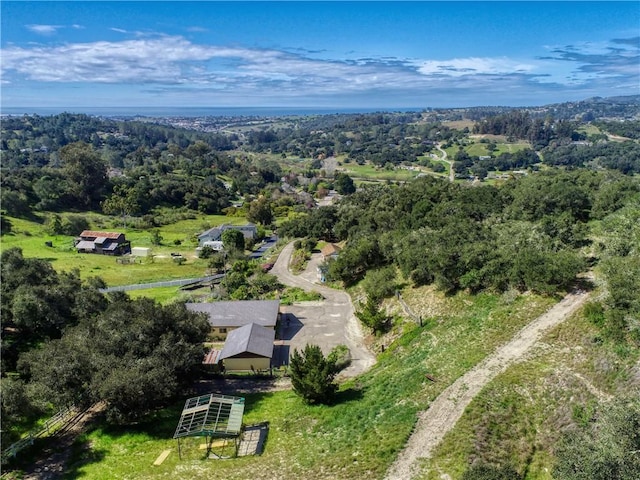aerial view featuring a view of trees