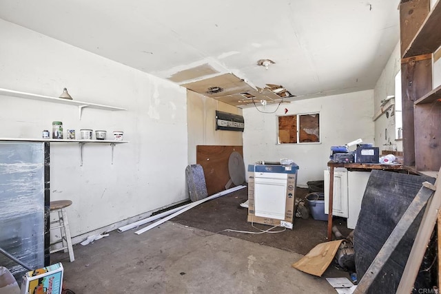 misc room with concrete flooring