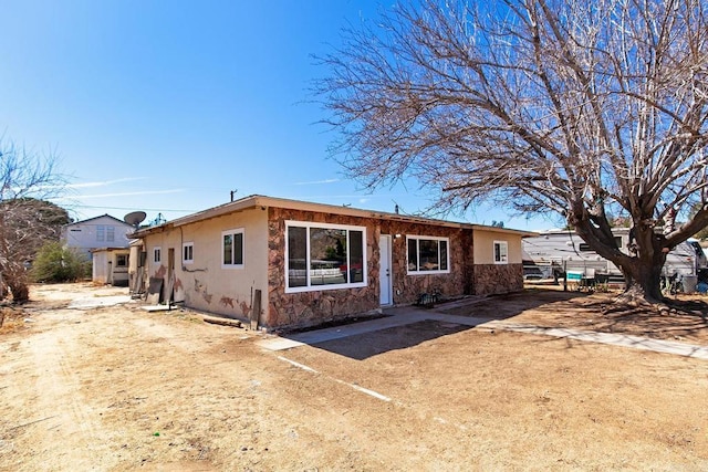ranch-style house with stucco siding