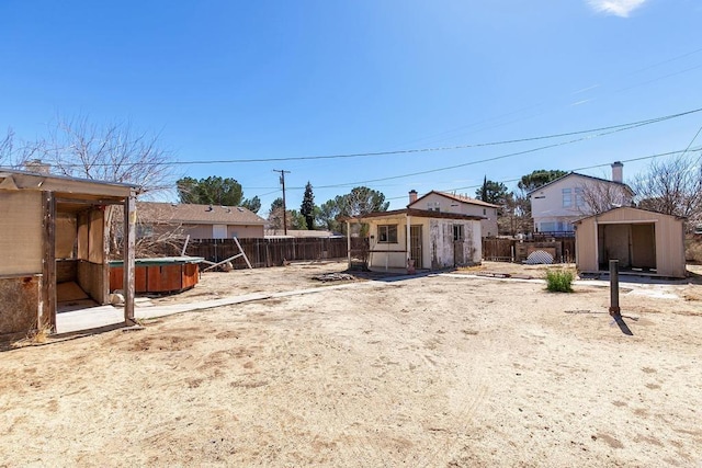 view of yard with an outdoor structure and a fenced backyard