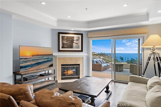 21732 Wesley Dr Unit 6, Laguna Beach, CA 92651 - living room featuring a tray ceiling, wood finished floors, a premium fireplace, crown molding, and recessed lighting