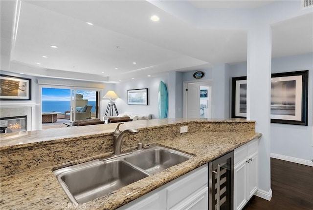 21732 Wesley Dr Unit 6, Laguna Beach, CA 92651 - kitchen with a sink, wine cooler, white cabinetry, light stone countertops, and recessed lighting