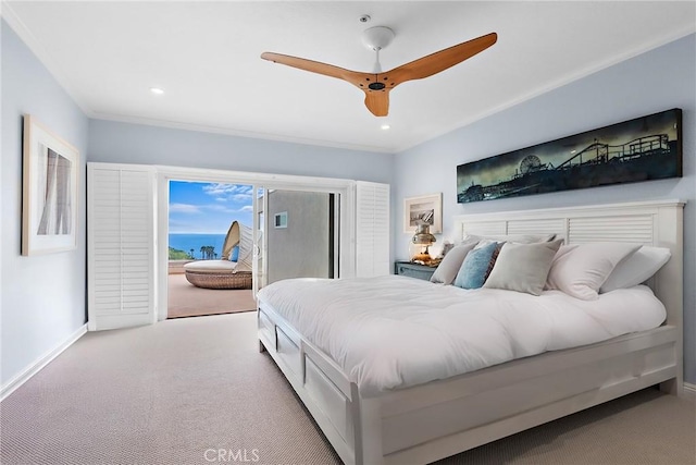 bedroom featuring crown molding, baseboards, access to outside, and carpet flooring