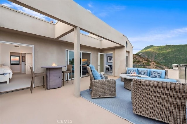 21732 Wesley Dr Unit 6, Laguna Beach, CA 92651 - view of patio with a mountain view and an outdoor living space with a fire pit